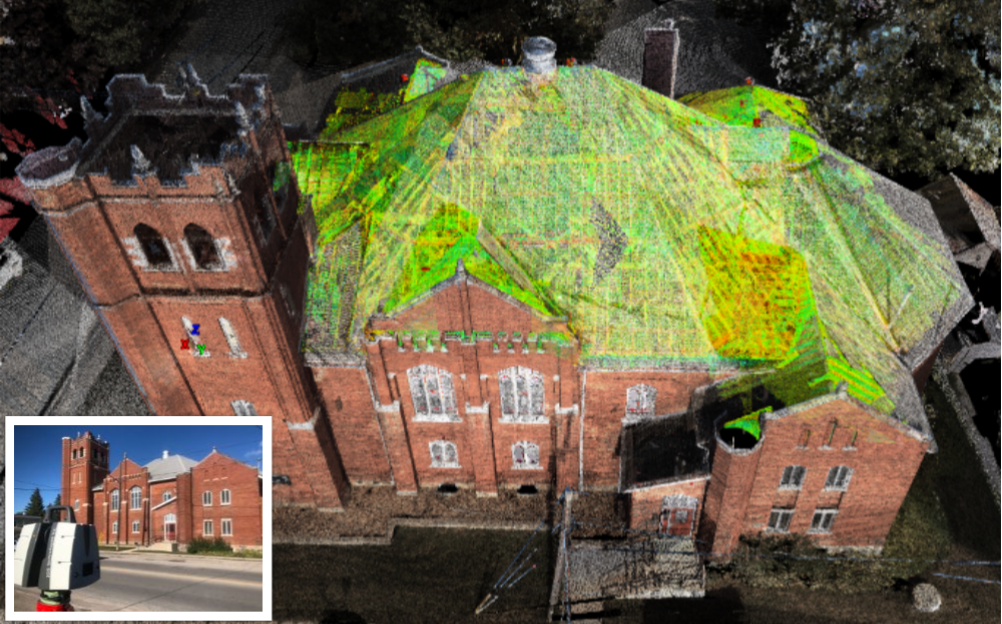 Team discussing revisions around a laptop displaying a building information model.